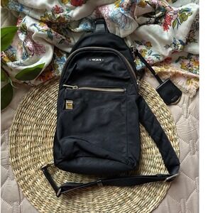 Tumi Voyageur Anna Sling Bag Black Nylon Gold Hardware Crossbody Backpack